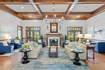 A living room filled with furniture and a fireplace